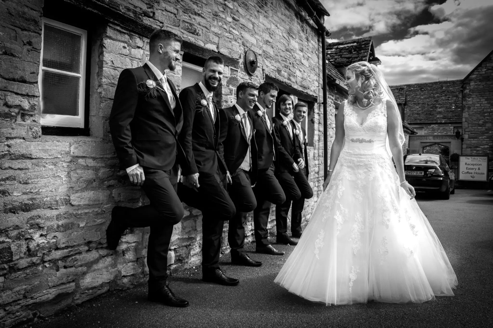 A joyful wedding party moment at The Talbot Hotel, Oundle.